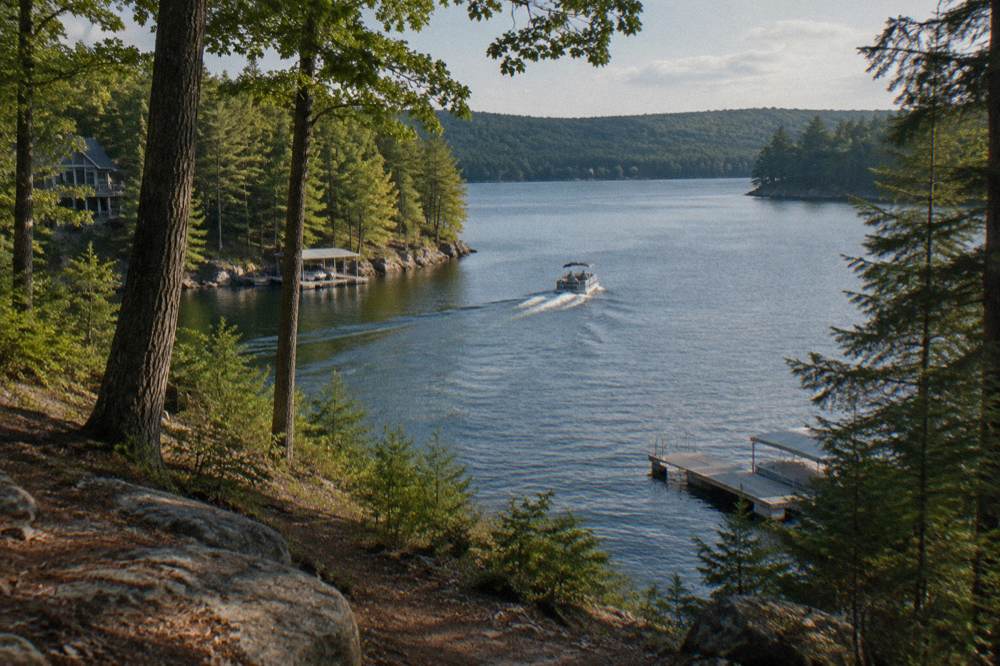 Pontoon boat cruising on open water at Deep Creek Lake